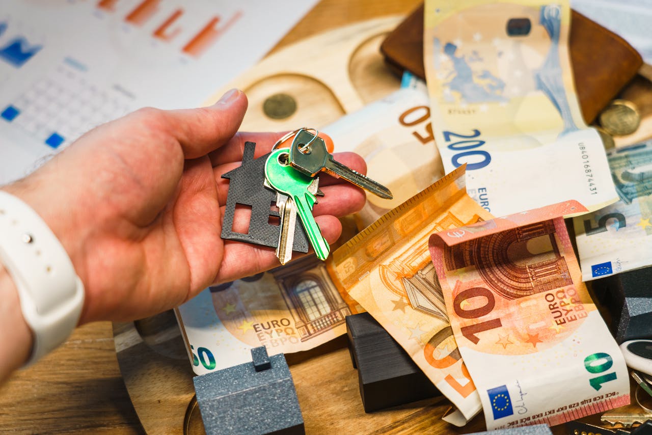 contact-bg House Keys Euro Banknotes Real Estate Investment Concept